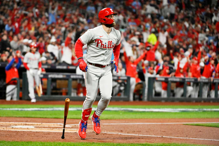 Bryce Harper drops his bat and watches his go-ahead home run against the Cardinals.